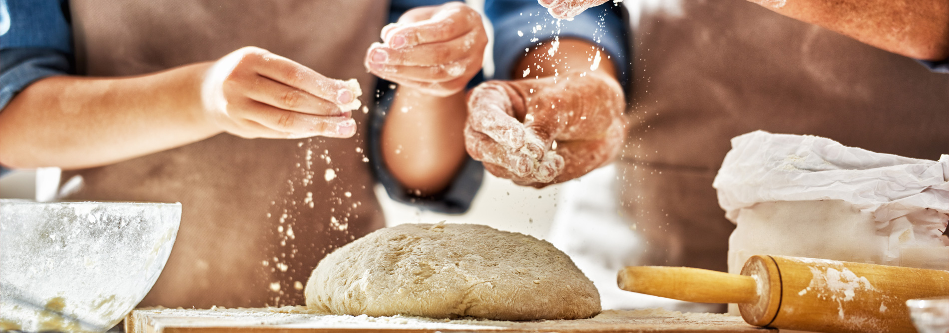 Women kneading dough